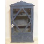 A contemporary blue painted wall cabinet, with glazed door above 2 drawers, H.83 W.49 D.20cm