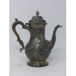 WITHDRAWN - A George III silver tea pot with embossed floral decoration, dated 1762, H.25cm, 25oz