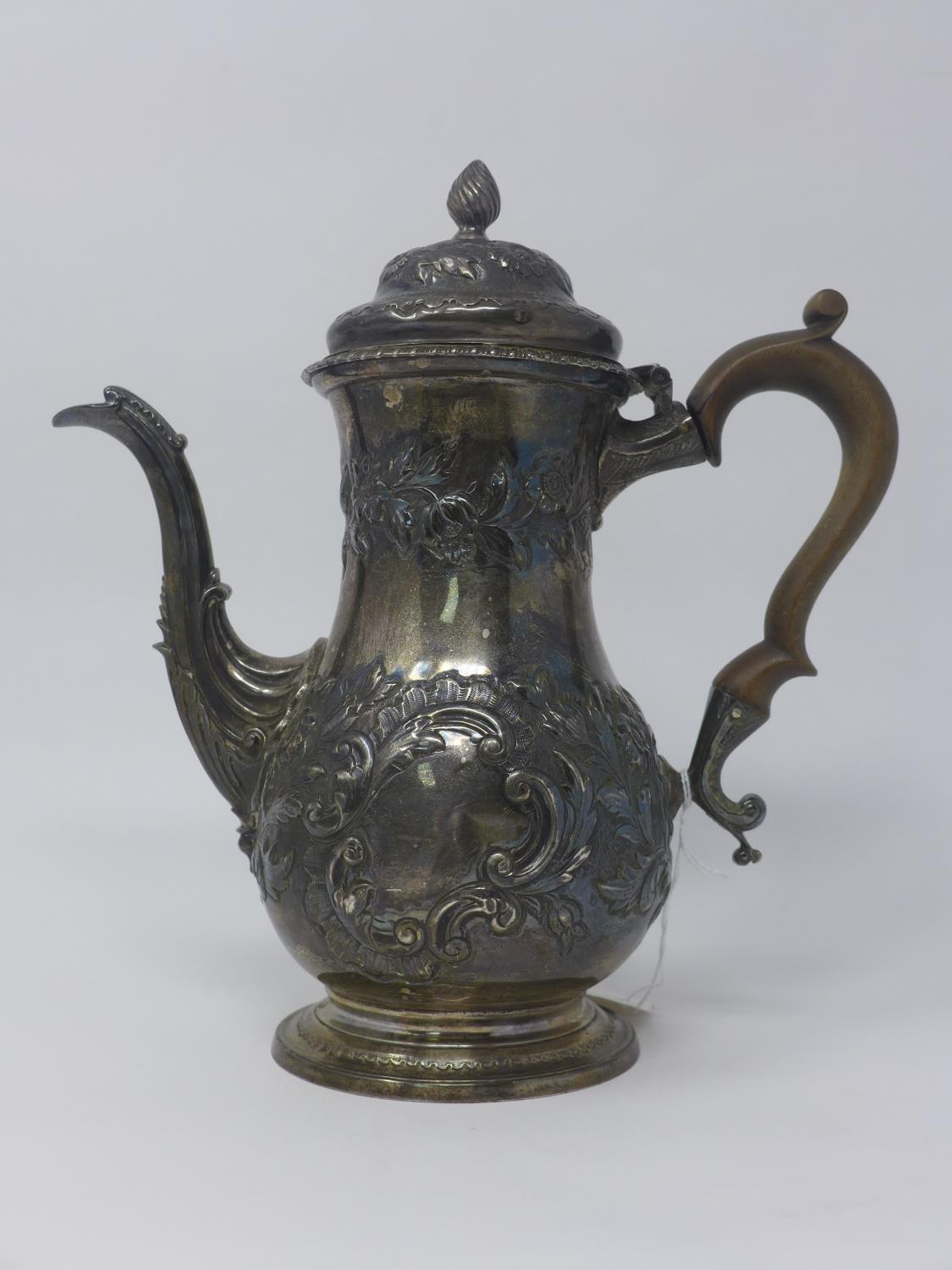 WITHDRAWN - A George III silver tea pot with embossed floral decoration, dated 1762, H.25cm, 25oz - Image 3 of 4