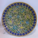 A middle eastern floral ceramic charger, D.47cm