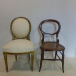 A Victorian mahogany giltwood balloon back chair, with cream upholstery, raised on tapering reeded