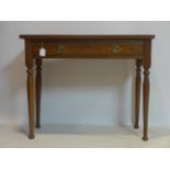 An oak side table with single drawer, raised on turned legs, H.71 W.94 D.40cm