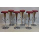 A set of six vintage heavy chrome bar stools with red leather seats