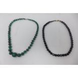 A vintage beaded jet necklace together with a beaded malachite necklace