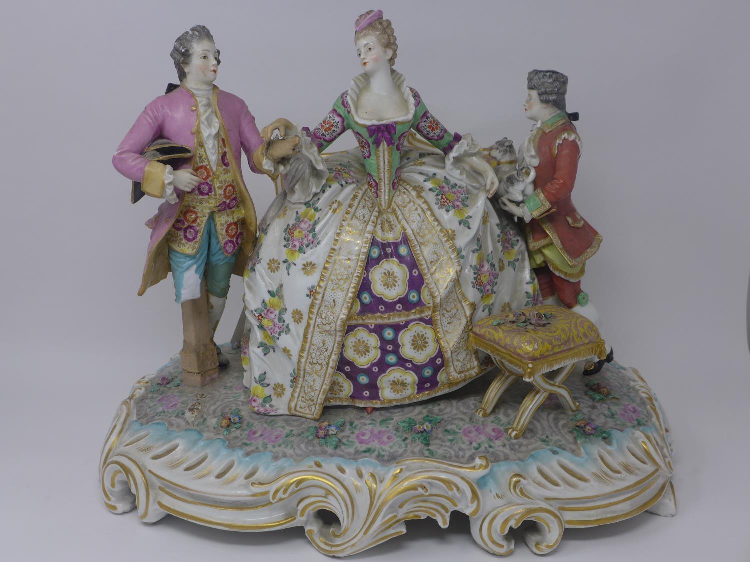 A late 18th/early 19th century Chelsea porcelain figural group, with gold anchor mark to verso,