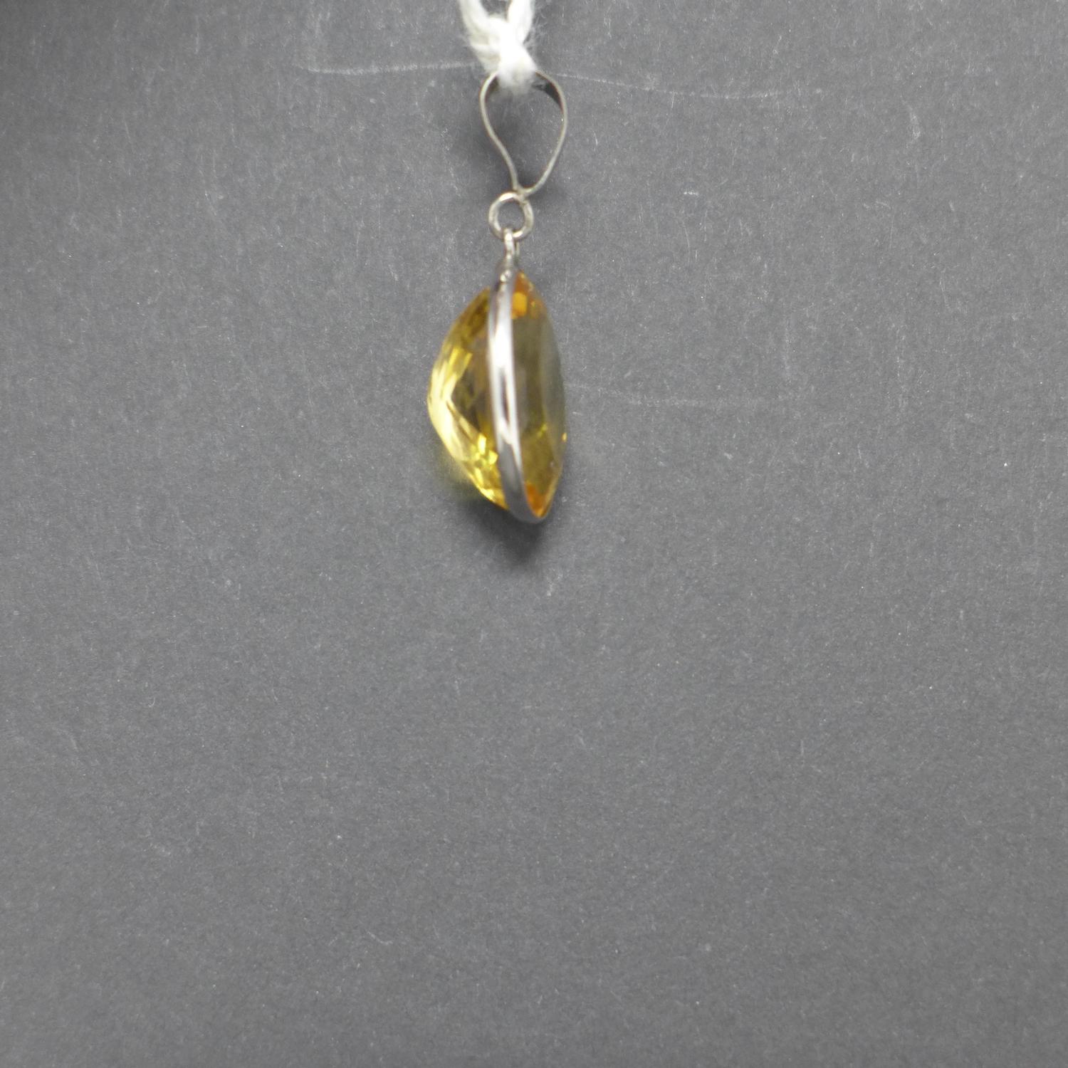 A 14ct white gold pendant set with an oval, faceted natural citrine to a white gold pendant loop, - Image 2 of 2
