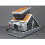 A Vintage Polaroid SX-70 Land Camera with leather case