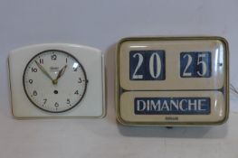 A vintage Italian enamelled Brillie wall clock together with a vintage Garant ceramic clock