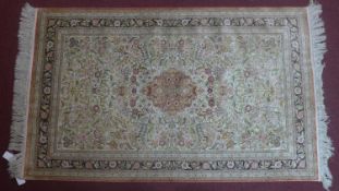 A 20th century fine silk Hereke rug with European design, 156 x 94cm