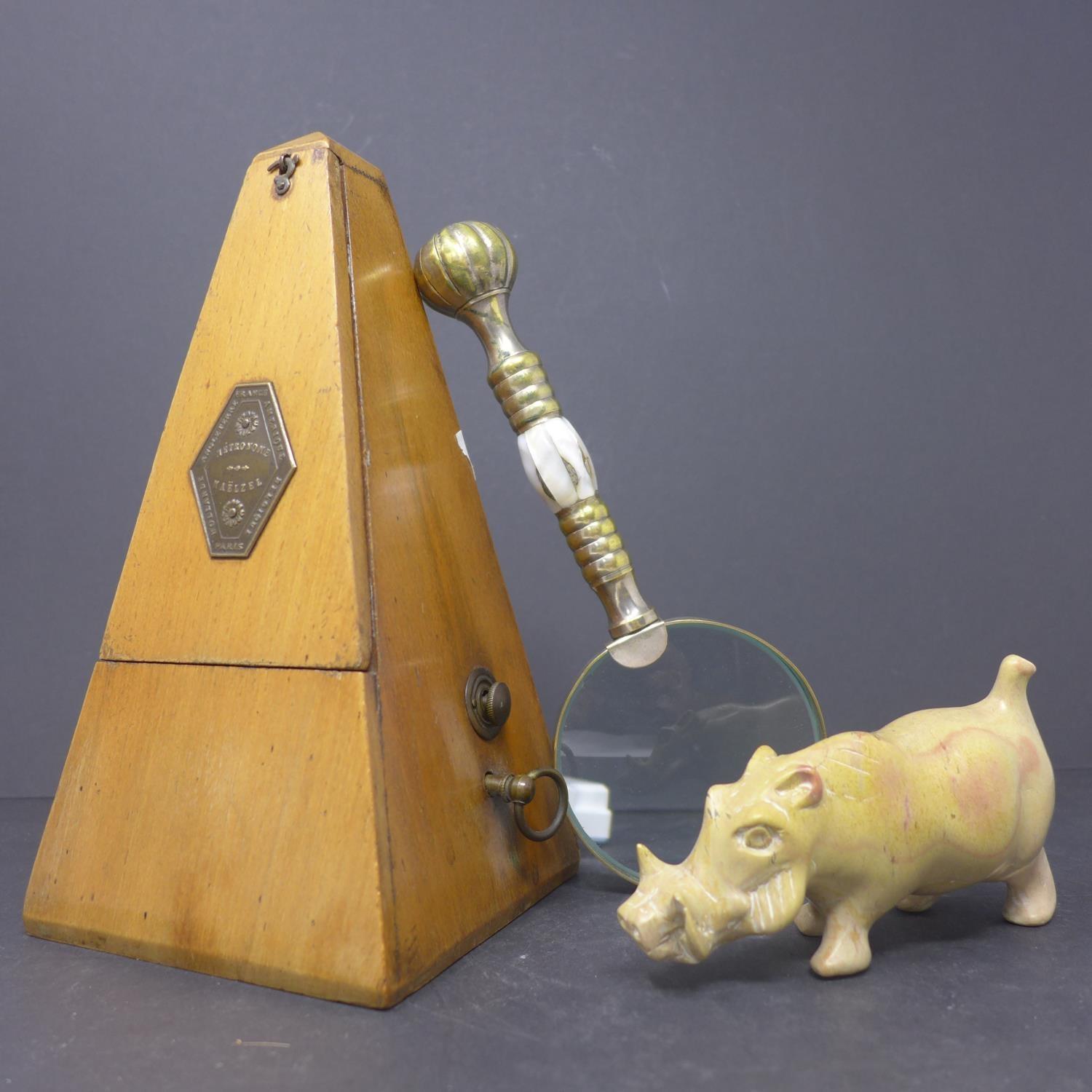 A Maelzel metronome, H.22cm, together with a stone carving of a warthog, H.7 W.12 D.4.5cm, and a - Image 2 of 5