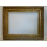 A large ornate gilt wood picture frame, 108 x 136cm outer, 78 x 106cm inner