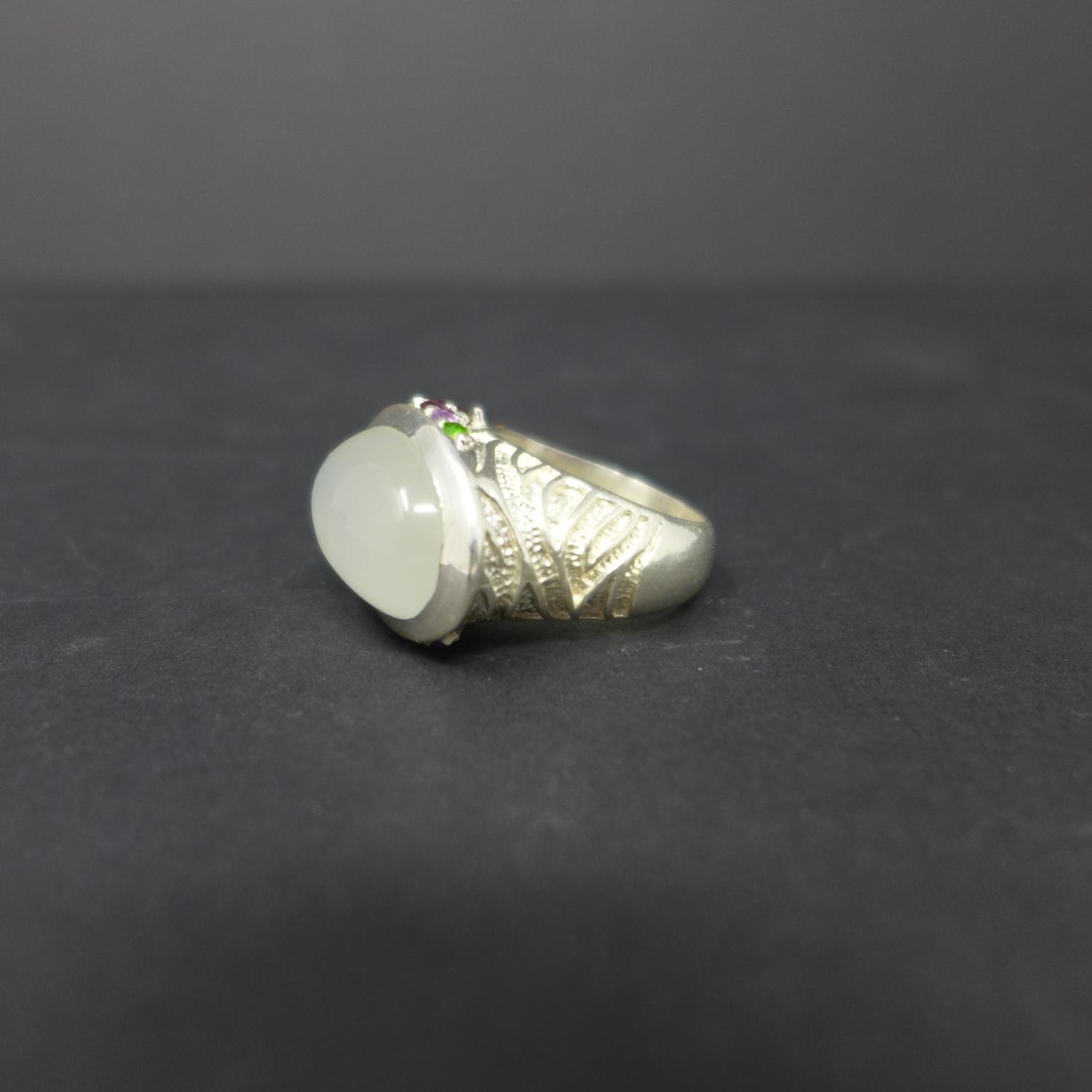 A sterling silver and moonstone ring set to the side of the mount with precious and semi-precious - Image 2 of 2
