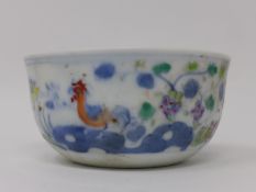 A Chinese doucai bowl, decorated with chickens and birds amongst flowers, with double blue circle to
