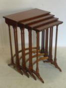 A Regency rosewood nest of 4 tables with brass inlay