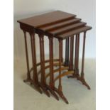 A Regency rosewood nest of 4 tables with brass inlay