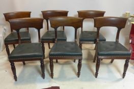 A set of six William IV mahogany dining chairs with green studded leather seats