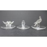Three Lalique frosted and clear glass pin dishes, to include a dove pin dish, H.9.5cm; lovebirds pin