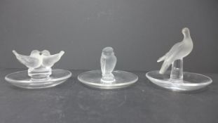 Three Lalique frosted and clear glass pin dishes, to include a dove pin dish, H.9.5cm; lovebirds pin