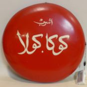 A vintage enamelled Arabic coca cola advertising sign, D.46cm