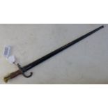 A pre WWI French model 1874 bayonet with steel scabbard, with various markings and