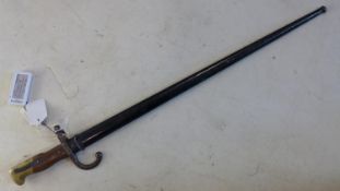 A pre WWI French model 1874 bayonet with steel scabbard, with various markings and