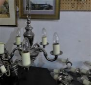 A pair of chrome plated chandeliers and 4 matching wall lights