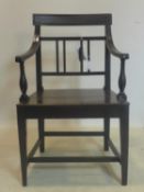 A Georgian solid oak open elbow chair, on tapered square legs joined by stretchers