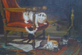 After Cornelis Raaphorst (1875-1954), Kittens playing by a fireplace, oil on canvas, bearing