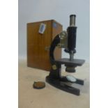 A vintage 'Prior' microscope in wooden travel case