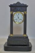 An inlaid and ebonised mantel clock, the circular Roman dial signed 'Aug te Lambert, Paris',