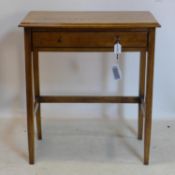 An oak side table with single drawer, on square tapered legs, H.85 W.76 D.46cm