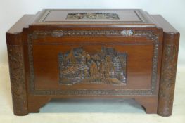 A 20th century Chinese carved camphor wood trunk, H.59 W.100 D.54cm