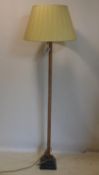 A 20th century bamboo standard lamp on ebonized base, H.161cm