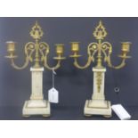 A pair of gilt metal and alabaster candlesticks, H.32cm