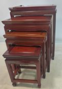 A 20th century Chinese hard wood nest of 4 tables