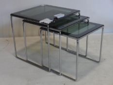 A vintage nest of 3 chrome tables with glass tops, H.35 W.36 D.36cm
