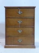 A Georgian small oak chest of four drawers, raised on pedestal base, H.60 W.46 D.27cm