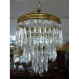 A Venetian style drop chandelier together with a pair of matching wall lights