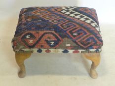 A Kelim upholstered foot stool