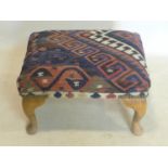 A Kelim upholstered foot stool