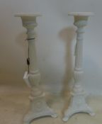 A pair of white painted cast iron pricket sticks, H.43cm