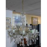 A 20th century 15 branch chandelier, with floral sconces and glass droplets, H.66 Diameter 58cm