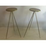 A pair of contemporary gilt metal cocktail tables, with circular tops raised on three splayed