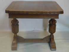 An early 20th century oak draw leaf dining table, H.76 W.150 D.90cm