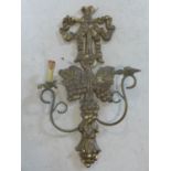A gilt two branch wall sconce, with ribbon finial and grape bunch decoration, 86 x 53cm
