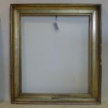 A gilt wood picture frame with label for 'Antonio Mancini', 103 x 90cm outer, 81 x 71cm inner