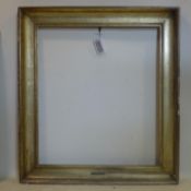 A gilt wood picture frame with label for 'Antonio Mancini', 103 x 90cm outer, 81 x 71cm inner