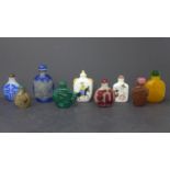 A collection of 9 Chinese snuff bottles, to include a late 19th century reverse glass painted