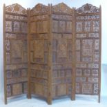 A pierced and carved teak 4 fold dressing screen, 188 x 204cm