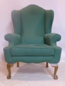 A Georgian style wing back armchair